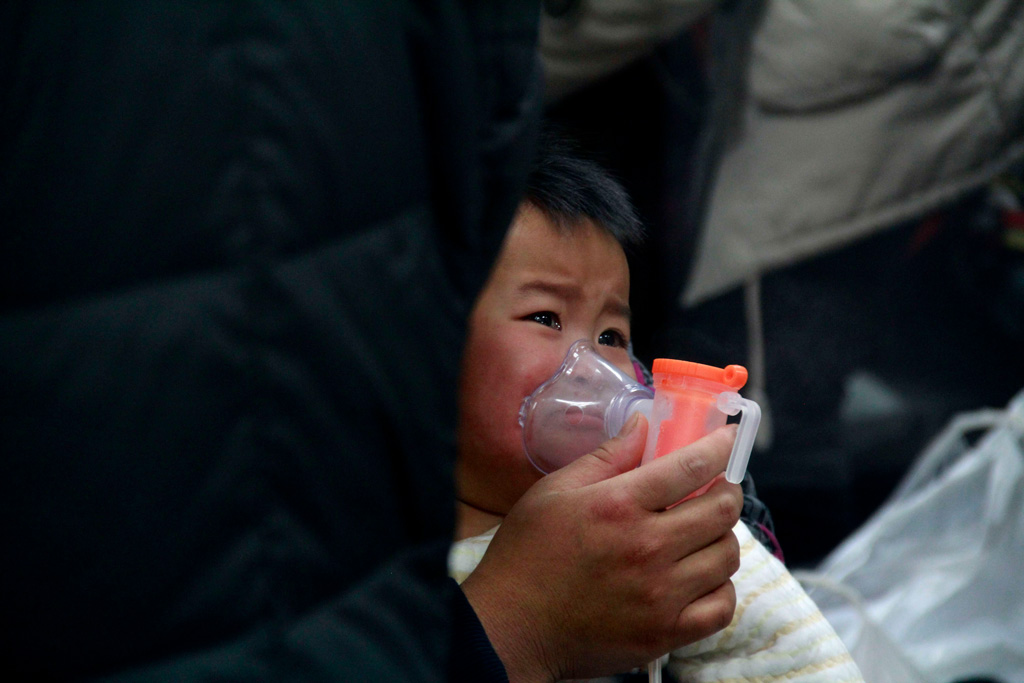 A young patient suffering a respiratory disease receiving treatment at a hospital in Beijing